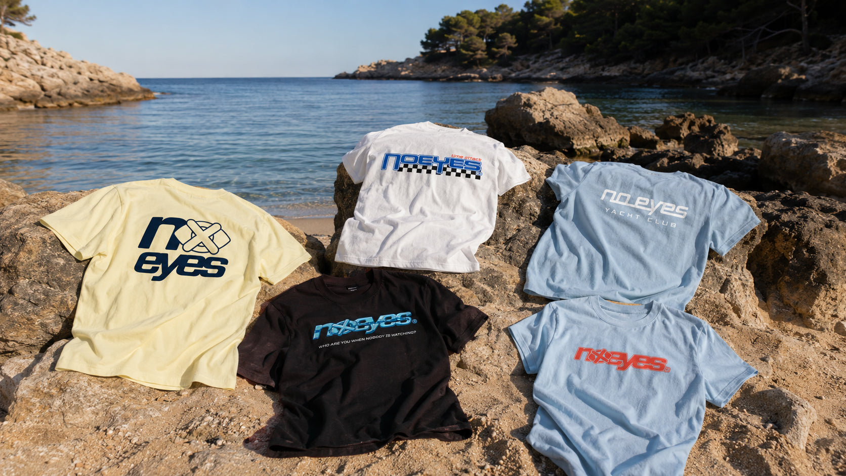 No Eyes t-shirts on rocks by the sea
